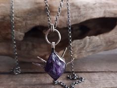 This raw amethyst crystal pendant necklace is hand forged in a 925 sterling silver bezel and a silver chain. It has been oxidized and polished, to give the piece an antique look.  A unique, fantasy piece of jewelry that will add character to any look and is ideal as a gift to yourself or to someone special.  The total length of the chain is 460mm, please contact me if you would like me to custom made the length of your chain. Please contact me if you would like a wax cord or any customization for your necklace. All my pieces are high quality handmade pieces, made by using only organic traditional silversmithing techniques and no chemicals. Thank you for visiting my shop!  ♥ Organic Traditional, Raw Amethyst Crystal, Raw Crystal Pendant, Raw Stone Necklace, Amethyst Crystal Necklace, Elven Jewelry, Necklace Amethyst, Crystal Pendant Necklace, Raw Amethyst