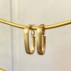 14KT Yellow Gold Matte/ Satin-Finish, Oval-Shaped Designed Hoop Earrings Medium Size Hoops Length: 28mm Width: 15mm Thickness: 4.8mm Weight: 3.08g Stamped 14K Omega clip backs Matte/Satin Finishes Makes a great gift! Please take a look at our other jewelry items. Let us know if you have any questions. Thank You, Legacy Saint Jewelry Nickel-free Brass Hoop Earrings, Modern Gold-tone Brass Hoop Earrings, Yellow Gold Tarnish-resistant Brass Hoop Earrings, Nickel-free Gold Alloy Hoop Earrings, Saint Jewelry, Luxury Gold-tone Brass Hoop Earrings, Gold Satin, Matte Satin, Fabric Ribbon