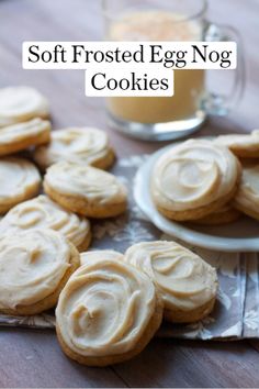 soft frosted egg nog cookies on a plate next to a cup of coffee