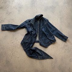 Beautiful Early/Mid 2000's Drkshdw By Rick Owens Denim Jacket With Draped Front. Can Be Worn With Long Tail Caught And Snapped At The Shoulder, Or Worn Long. When The Tail Is Caught At The Shoulder It Creates A Striking Cowl Like Front. The Details On This Jacket Are Exquisite, With French Seams Throughout. The Jacket Is Shaped With Rick Owens Signature Attention To Detail, Very Slightly Fitted Through The Waist, Darts In The Pockets, And Extra Long Sleeves. Condition On This Jacket Is V Good. Fitted Distressed Dark Wash Outerwear, Fitted Distressed Denim Blue Outerwear, Dark Wash Recycled Denim Outerwear, Recycled Denim Outerwear In Dark Wash, Fitted Dark Wash Recycled Denim Outerwear, Drape Front Jacket, Rick Owens Jacket, Extra Long Sleeves, French Seam