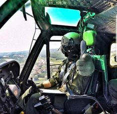 a man sitting in the cockpit of an airplane