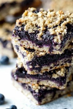 blueberry oatmeal bars stacked on top of each other