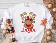 Personalized Name Reindeer Shirt,Toddler,Youth,Adult Holiday Shirt,Reindeer Christmas Joy Shirt ,Reindeer Baby Bodysuit. HOW TO ORDER: *    Select size & sleeve length  *    For personalized designs - enter your customization in the "Add your personalization" box.  *    ADD TO CART and proceed to checkout *    Type additional order information in the "Note to seller" Box. CARE  *    Wash inside out w/cold water  *    Low heat tumble dry. PRODUCTION TIME: This item made to order and can take 1 to 2 business days before shipping. We do not carry pre-printed shirts. All shirts are printed to order, so we are unable to accept returns or exchanges. Make sure you check our size chart above in the picture carousel. Also, print colors may very slightly from the picture seen on your phone, tablet o Reindeer Shirt, Reindeer Christmas, Holiday Shirt, Holiday Shirts, Christmas Joy, Christmas Reindeer, Baby Bodysuit, Reindeer, Kids Tshirts