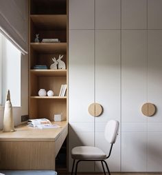 a white chair sitting in front of a wooden desk next to a book shelf filled with books