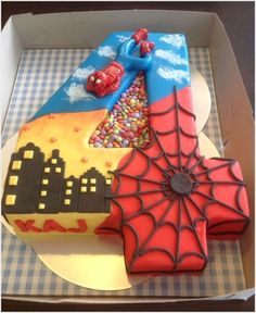 a cake in the shape of a spiderman