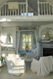 an old fashioned bedroom with white furniture and decor on the walls, along with a fireplace