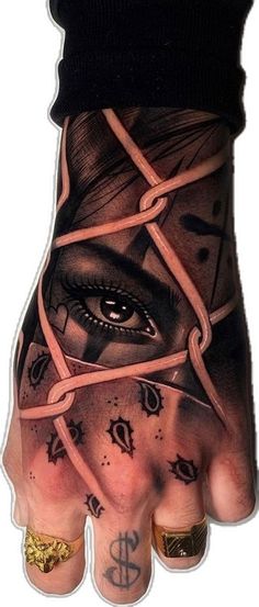 a hand with tattoos on it has an eye in the middle and chains around it