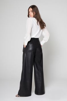 These wide-leg faux leather pants sit at your natural hip level. 85% Polyester 15% Pu Dry Clean Only Model is wearing size: S Made in the USA Model: Style: ADM6418 Wide Leg Faux Leather Pants, Black Faux Leather Wide Leg Pants Outfit, Faux Leather Wide Leg Pants, Leather Wide Leg Pants, Wide Leg Pants Outfit, Wardrobe Wishlist, Leather Pant, Model Style, Faux Leather Pants