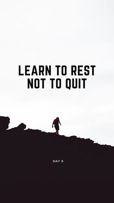 a man standing on top of a hill with the words learn to rest not to quit