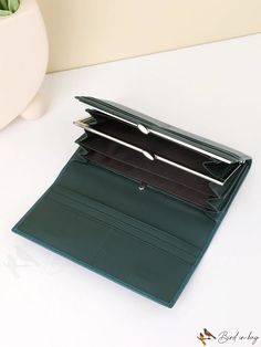 BirdinBag - Stylish & Spacious Wallet: Solid Color with Ample Card Capacity Green Clutch Wallet For Daily Use, Trendy Green Wallet With Removable Pouch, Green Clutch Wallet With Card Slots, Green Portable Wallet For Daily Use, Portable Green Wallet For Daily Use, Leather Style, Green Pattern, Style Minimalist, Save The Planet