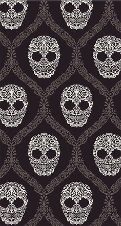 a black and white pattern with skulls on it