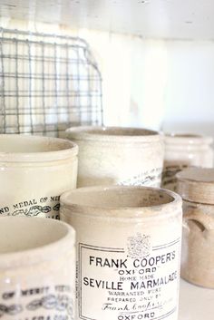 many jars are lined up on the shelf