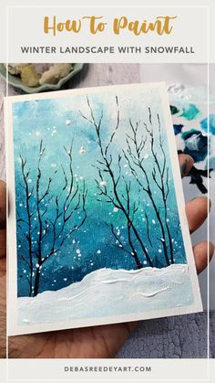 a hand holding up a card with trees painted on it and the words how to paint winter