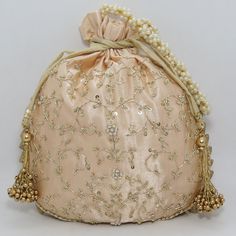 "traditional indian golden zardosi sequin embroider wedding giveaway bag potli | beautiful handmade gifting drawstring purse for woman Package Contents: 1 Size: 10\" x 8\" Designed with the heart, this beautiful Potli or batawa bag are eye catchy and made of premium material. Key Features: Zardosi embroidery art work. This potli is good match with both Indian and western outfits and are superb for wedding and festive parties. This would be best complement to your designer saree, lenhga or any ot Gold Embroidered Fabric For Navratri Reception, Gold Embroidered Fabric For Reception And Navratri, Festival Reception Potli Bag With Zari Work, Zari Work Potli Bag For Festivals And Reception, Traditional Potli Bag With Dori Work For Reception, Party Zari Work Potli Bag, Bollywood Style Potli Bag With Dori Work For Reception, Party Potli Bag With Zari Work, Gold Embroidered Fabric With Gota Work For Reception