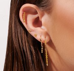 This enchanting helix features a delicate lotus design set with vibrant natural yellow diamonds on a solid gold base. Perfectly complements any ear stack with its effortless elegance and radiant sparkle. Gold Huggie Earrings, Yellow Diamonds, Gold Wedding Jewelry, Vintage Fans, Lotus Design, Ear Stack, Wedding Bridal Jewellery, Diamonds And Gold, Diamond Drops