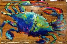 a painting of a blue crab on a wooden board