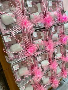 a display case filled with lots of pink and white items