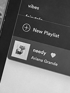 a black and white photo of a cell phone with the text new playlist on it