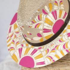 This Victoria Artisanal Hat is crafted with care by Alicia in Oaxaca, Mexico. Its distinctive, hand-painted design stands out with vibrant colors and fun patterns, creating a stylish and versatile accessory suitable for any season. Traditional Mexican aesthetics get a modern twist in this beautiful, curated selection of hats. Size: Medium 22.8 inches. One size fit most; hat features an internal elastic band for comfort. Materials: Painted jute. The hat brim features a leather band, and colors of Tortilla Warmer, Painted Hats, Thank You Messages, Luxury Candles, Elastic Band, Leather Band, Cool Patterns, Hand Weaving, Vibrant Colors