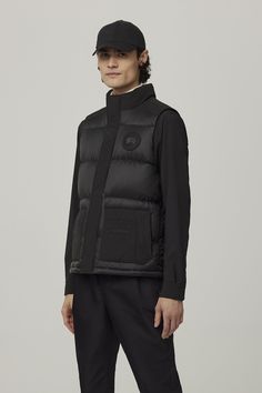 The Paradigm Freestyle Vest reimagines one of our most iconic silhouettes in two best-selling fabrics for a modern, mixed-media style. It has a down-filled collar and quilted body for warmth and style, wear it on its own or layered. Luxury Black Quilted Jacket, Fitted Nylon Puffer Jacket For Work, Luxury Quilted Down Jacket With Padded Collar, Fitted Functional Puffer Jacket With Padded Collar, Luxury Nylon Puffer Jacket, Designer Nylon Puffer Jacket For Fall, Designer Quilted Nylon Outerwear, Designer Fitted Puffer Jacket With Padded Collar, Designer Quilted Nylon Puffer Jacket