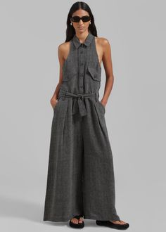 Color: Black Melange Midweight linen blend fabric Relaxed fit Sleeveless Pointed collar Wide leg Front pleated detailing Breast flap pockets Side slant pockets  Illusion welt back pockets  Front button closure Slip on style  Unlined 76% Linen 24% Cotton  Dry Clean  By The Frankie Shop. Imported Black Halter Jumpsuit, Denim Suit, The Frankie Shop, Halter Jumpsuit, Frankie Shop, Paris Woman, Linen Jumpsuit, Press Tour, Jumpsuit Black