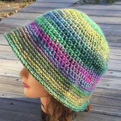 a woman's hat with multicolored stripes on it