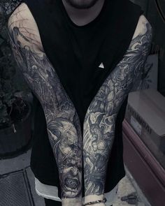 a man with tattoos on his arms and arm