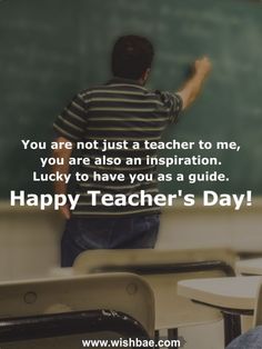 a man standing in front of a blackboard with the words happy teacher's day