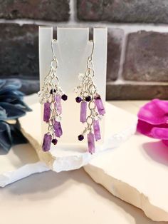 "These are handmade earrings with amethyst gemstones, silver findings and various other beads. Sterling silver earring hooks. These measure about 3\" top to bottom." Amethyst Dangle Earrings For Jewelry Making, Purple Long Drop Earrings With Ear Wire, Amethyst Dangle Earrings With Natural Stones, Amethyst Natural Stone Dangle Earrings, Silver Dangle Beaded Earrings With Natural Stones, Silver Amethyst Dangle Earrings, Silver Amethyst Dangle Crystal Earrings, Silver Dangle Earrings With Natural Stones, Handmade Amethyst Dangle Crystal Earrings