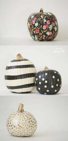 two black and white painted pumpkins sitting side by side on a shelf, one with polka dots