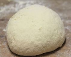 a ball of dough sitting on top of a counter