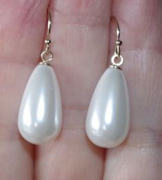 Being offered is a fabulous 14K GOLD FILLED WHITE 30MM TEAR DROP WHITE COATED JAPANESE PEARL EARRINGS  THESE PEARLS ARE NEW OLD STOCK PEARLS MADE IN JAPAN IN 1950'S  THESE OLD STOCK PEARLS  HAVE INCREDIBLE LUSTER AND ARE MEDIUM SIZE  EARRINGS COATED JAPANESE PEARLS ARE FAMOUS MAN MADE PEARLS / QUALITY AND LUSTER THEY ARE NEW OLD STOCK FROM HOBE COMPANY. I HAVE FEW PAIRS.  PLESAE SEE PHOTOS. QUALITY PEARL TEAR DROPS. THE WHOLE EARRINGS DROPS ARE 30 MM/ 1.20 INCHES /  2.1 GRAMS INCREDIBLE LUSTER AND SHINE / 14K SOLID GOLD EAR WIRES  IF YOU WANT SOMETHING LARGE AND YET WEIGHT LIGHT, THESE ARE FOR YOU. YOU WILL LOVE WEARING THEM.Privacy policy, return policy; If you are returning the merchant just because you did not like it, you will have to pay for return ship. option 1 ; you can either have Classic White Drop Earrings, Classic White Pear-shaped Earrings, Classic White Teardrop Earrings For Wedding, White Teardrop Pearl Earrings For Party, White Teardrop Dangle Earrings For Anniversary, Formal White Hypoallergenic Pearl Earrings, White Hypoallergenic Pearl Earrings For Party, Formal White Hypoallergenic Teardrop Earrings, Hypoallergenic White Pearl Earrings For Party