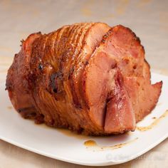 the ham is sliced and ready to be served on the plate for consumption or consumption