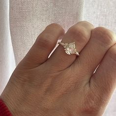 a woman's hand with a ring on it