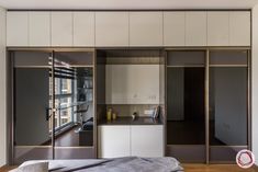 a bedroom with sliding glass doors and an open closet in the wall next to it