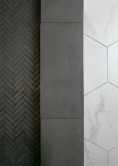 two black and white tiled walls next to each other