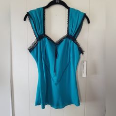 Pretty, Classy, Sexy Top. Bill Burns. Size 6. Never Worn. Turquoise Blue With Black Lace. 16 Inches Across. 24 Inches Length. Nicely Lined On Inside. 100% Silk. Pet Free And Smoke Free Home Blue Top, Silk Top, Turquoise Blue, Black Lace, Black Blue, Blue Black, Top Blouse, Womens Tops, Size 6