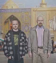 two men standing next to each other in front of a building with ornate designs on it