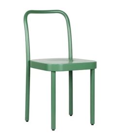 a green chair sitting on top of a white floor