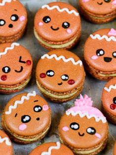 gingerbread macarons are arranged on a baking sheet with the words gingerbread macaroons