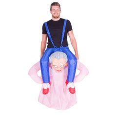 a man riding on the back of an inflatable costume that looks like an old woman