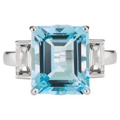 Inspired by the sparkling hues of the Mediterranean Sea, this elegant ring from the Andalusian Collection features a stunning natural sky blue topaz surrounded by two dazzling white topaz baguettes, set in 9ct white gold. The Andalusian-inspired luxury jewellery London designed collection takes inspiration from Hispano-Moorish architectural styles of the enchanting southernmost region of Spain. The gemstone jewellery from this collection designed by British Jewellers boasts vibrant yet sophisticated combinations of natural-coloured gemstones with precious metals. Our luxury gemstone jewellery piece, the Octagon White Gold Ring in White Topaz & Blue Topaz octagon-cut central stone measures 12x10mm and side stones baguettes measure 6x3mm. The gemstones are set in a luxurious Solid 9ct White