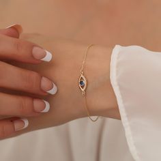 "Our 14K Solid Gold and diamond eye bracelet is suitable for daily use. It is a beautiful and meaningful gift for you and your loved ones. All of our products are 14 Carat Gold and Real Diamonds and are of very high quality and sparkle. F E A T U R E S * Made to Order. * Gold KT: 14K * Choice of Gold Color: Yellow Gold, Rose Gold, White Gold * Gem Stone: Genuine Diamond * Diamond-Cut: Round * Diamond Carat: 0.07 ct. * Sapphire Carat: 0.25 ct. * Height: 14,00 mm / 0.55 inch * Width: 7,50 mm / 0.30 inch * Diamond Color-Clarity: G.VS Color, SI Clarity * Choice of chain length: 5\", 5.5\", 6\", 6.5\", 7\" (+1\") * Setting Type: Bezel Setting * Ready to Ship in 1-3 Business Days * 100% US sourced * 2 Years Warranty * Free Express International Shipping * Free returns within 14 days from the ord Birthstone Diamond Bracelet As Gift, Elegant Adjustable Jewelry With Diamond Eyes, Evil Eye Diamond Jewelry As Gift, Diamond Evil Eye Jewelry Gift, Evil Eye Diamond Jewelry Gift, Elegant Diamond Birthstone Bracelet Gift, Elegant Gold Evil Eye Bracelet With Diamond Details, Elegant Gold Evil Eye Bracelet With Diamond Eyes, 14k Gold Birthstone Diamond Bracelet As Gift