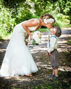 a woman kissing a young boy on the cheek in front of trees and grass, with an instagram page below