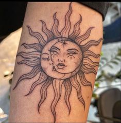 a sun and moon tattoo on the arm