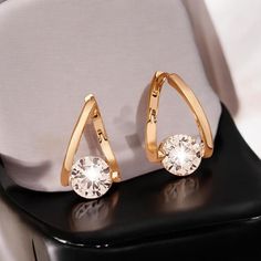 ✿ These 1.20 carat round cut lab diamond earrings are designed as hoop earrings combining trendy statement jewelry with classic elegance Perfect for party wear they make an ideal anniversary gift for her adding sparkle and sophistication to any ensemble. ✿ 𝐌𝐚𝐢𝐧 𝐒𝐭𝐨𝐧𝐞 𝐃𝐞𝐭𝐚𝐢𝐥𝐬 ✿ ▸ Main Stone: Moissanite ▸ Main Stone Shape: Round Cut  ▸ Main Stone Dimension : 6 MM (Approx.) ▸ Main Stone Color: Colorless ▸ Main Stone Clarity: VVS1  ▸ Total Carat Weight: 1.20 TCW (Approx.)  ▸ Stone Variant : Lab Diamond (CZ), Moissanite , Lab Grown Diamond (CVD) ✿ 𝐌𝐞𝐭𝐚𝐥 𝐃𝐞𝐭𝐚𝐢𝐥𝐬 ✿ ▸ Metal Purity: 𝟗𝟐𝟓 𝐒𝐢𝐥𝐯𝐞𝐫 / 𝟏𝟎𝐊 𝐆𝐨𝐥𝐝/𝟏𝟒𝐊 𝐆𝐨𝐥𝐝 /𝟏𝟖𝐊 𝐆𝐨𝐥𝐝 ▸ Metal Tone: 𝐖𝐡𝐢𝐭𝐞 / 𝐘𝐞𝐥𝐥𝐨𝐰 / 𝐑𝐨𝐬𝐞 𝐆𝐨𝐥𝐝 ▸ Use Occasion: Engagement, Wedding, Anniversary, Valentines Modern Round Cubic Zirconia Hoop Earrings, Modern Cubic Zirconia Hoop Earrings, Elegant Hoop Crystal Earrings With Cubic Zirconia, Elegant Cubic Zirconia Hoop Crystal Earrings, Modern Cubic Zirconia Hoop Earrings In Diamond White, Modern Diamond White Cubic Zirconia Hoop Earrings, Cubic Zirconia Round Hoop Earrings, Elegant Hoop Crystal Earrings For Anniversary, Party Hoop Earrings With Prong Setting In Cubic Zirconia