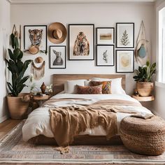 a bedroom with pictures on the wall above the bed and various plants in baskets around the bed