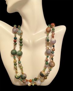 Beautiful multiple colors agate stone necklace. The necklace has agate stones of green, lavender, white, brown and rust. It hangs over the neck without a clasp. It's 35' long.  It's in a great vintage condition. Adjustable Multicolor Jasper Necklaces, Multicolor Jasper Spiritual Necklace, Spiritual Multicolor Jasper Necklaces, Vintage Multicolor Necklaces With Natural Stones, Vintage Multicolor Agate Jewelry, Vintage Multicolor Natural Stones Necklace, Vintage Agate Necklaces With Colorful Beads, Vintage Agate Necklace With Colorful Beads, Unique Multicolor Jasper Necklaces