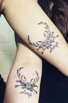 two women with matching tattoos on their arms