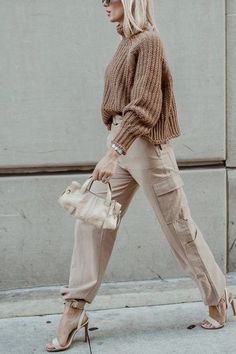 "14 Women's Cargo Pants with a Workwear Feel: Stylish and Functional" Heels And Cargo Pants, Fall Cargo Pants Outfit Women, Gold Cargo Pants Outfit, 2023 Cargo Pants Outfit, Dressed Up Cargo Pants Outfit, Cargo Pants Winter Outfits Women, Satin Cargo Pants Outfit Winter, Cream Cargo Pants Outfit Winter, Cream Cargo Pants Outfit Street Styles